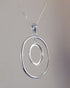 swinging centre silver pendant