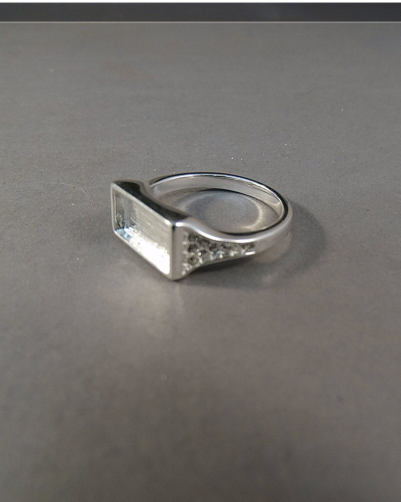 Solid silver Ring with oblong setting area with cz stones