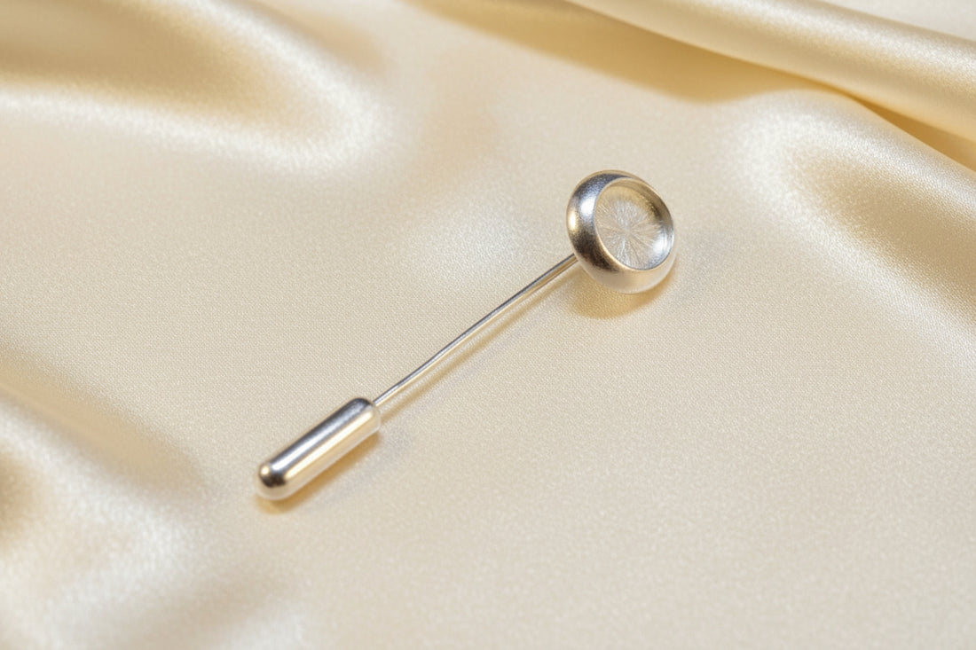 Silver stick pin setting with a bezel to fit a 10x8 cabochon complete with protector.