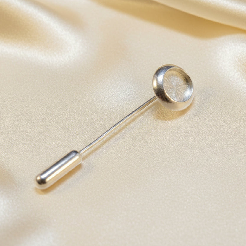 Silver stick pin setting with a bezel to fit a 10x8 cabochon complete with protector.