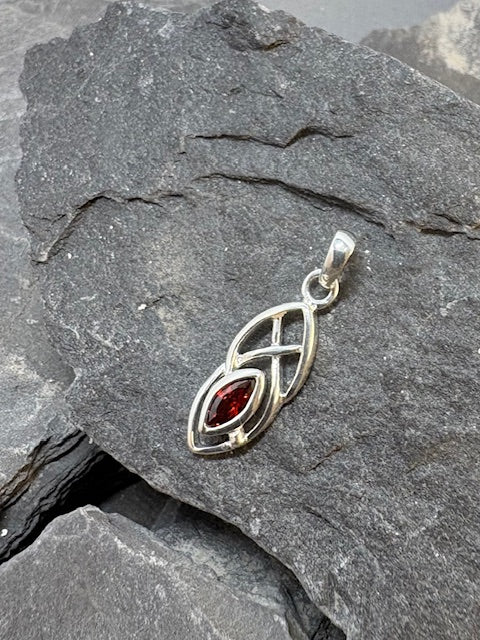 SILVER CELTIC STYLE PENDANT WITH RED FACCETTED STONE