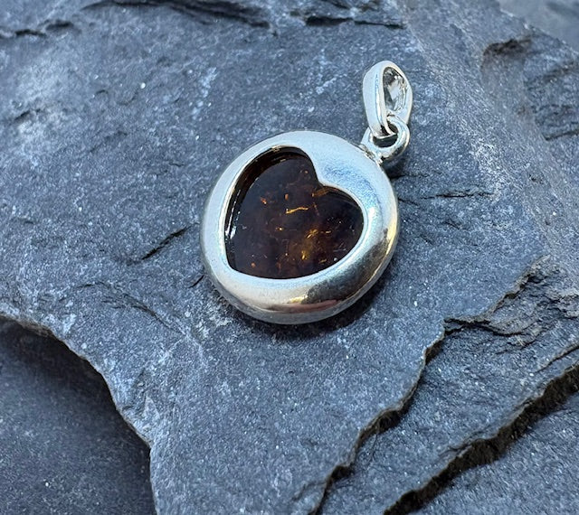 ROUND SILVER AMBER PENDANT WITH HEART CUT OUT