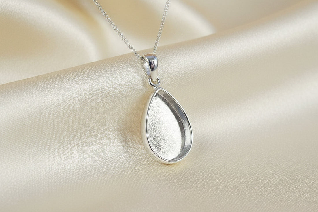 silver solid back teardrop pendant