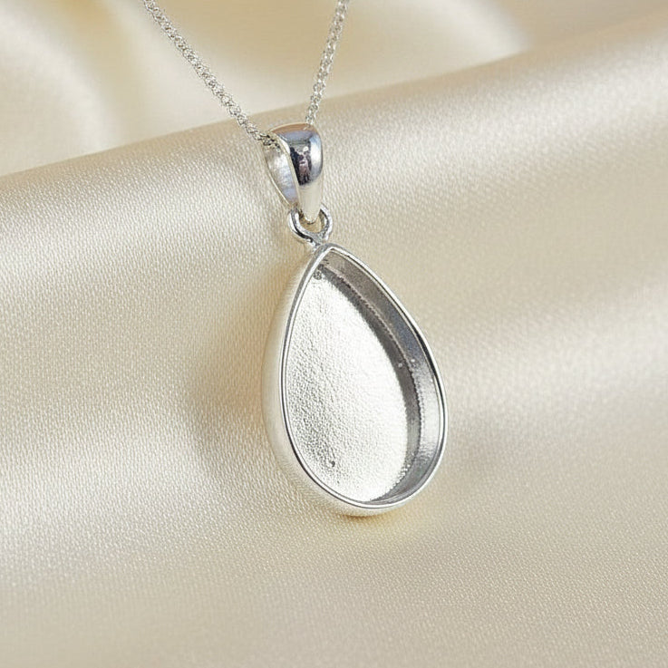 silver solid back teardrop pendant