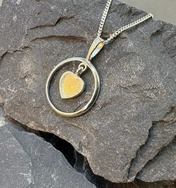 Solid silver pendant with heart shaped setting area for resin