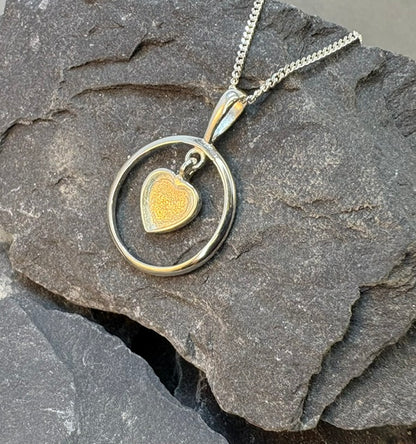 Solid silver pendant with heart shaped setting area for resin