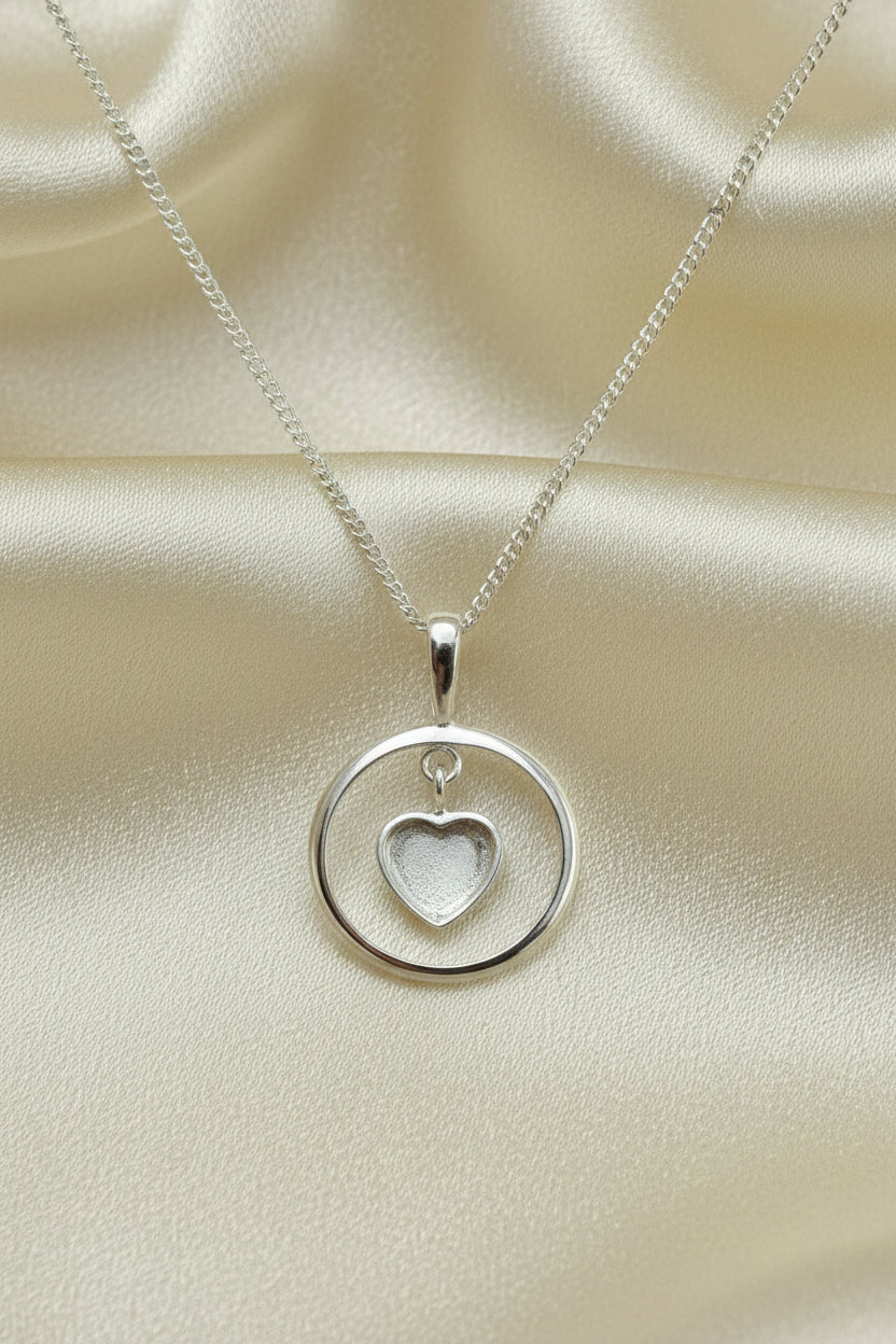 Solid silver pendant with heart shaped setting area for resin