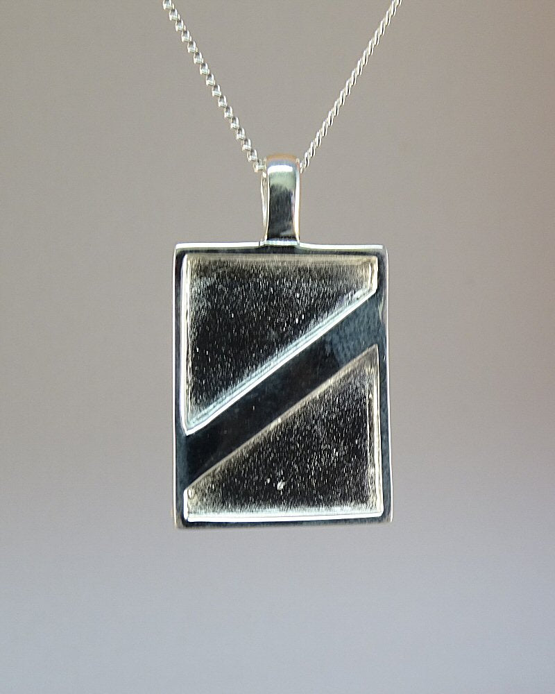 Silver solid backed modern style pendant for use with resin