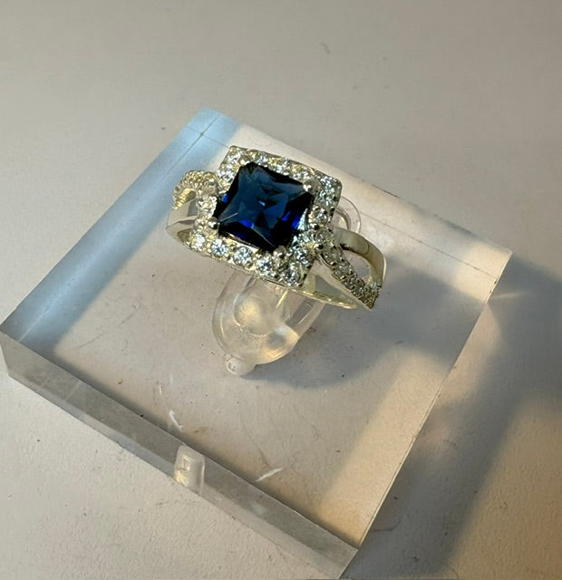 SILVER RING WITH CZ AND SQUARE BLUE STONE